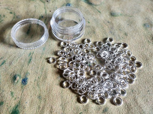 140+ 6mm brass jump rings with a silver finish